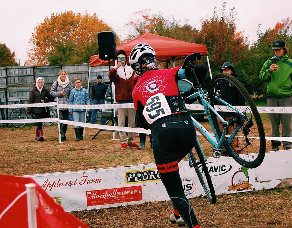 Katherine Johnson jumps the barriers on a borrowed bike at Orchard Cross on Oct. 25, 2015.