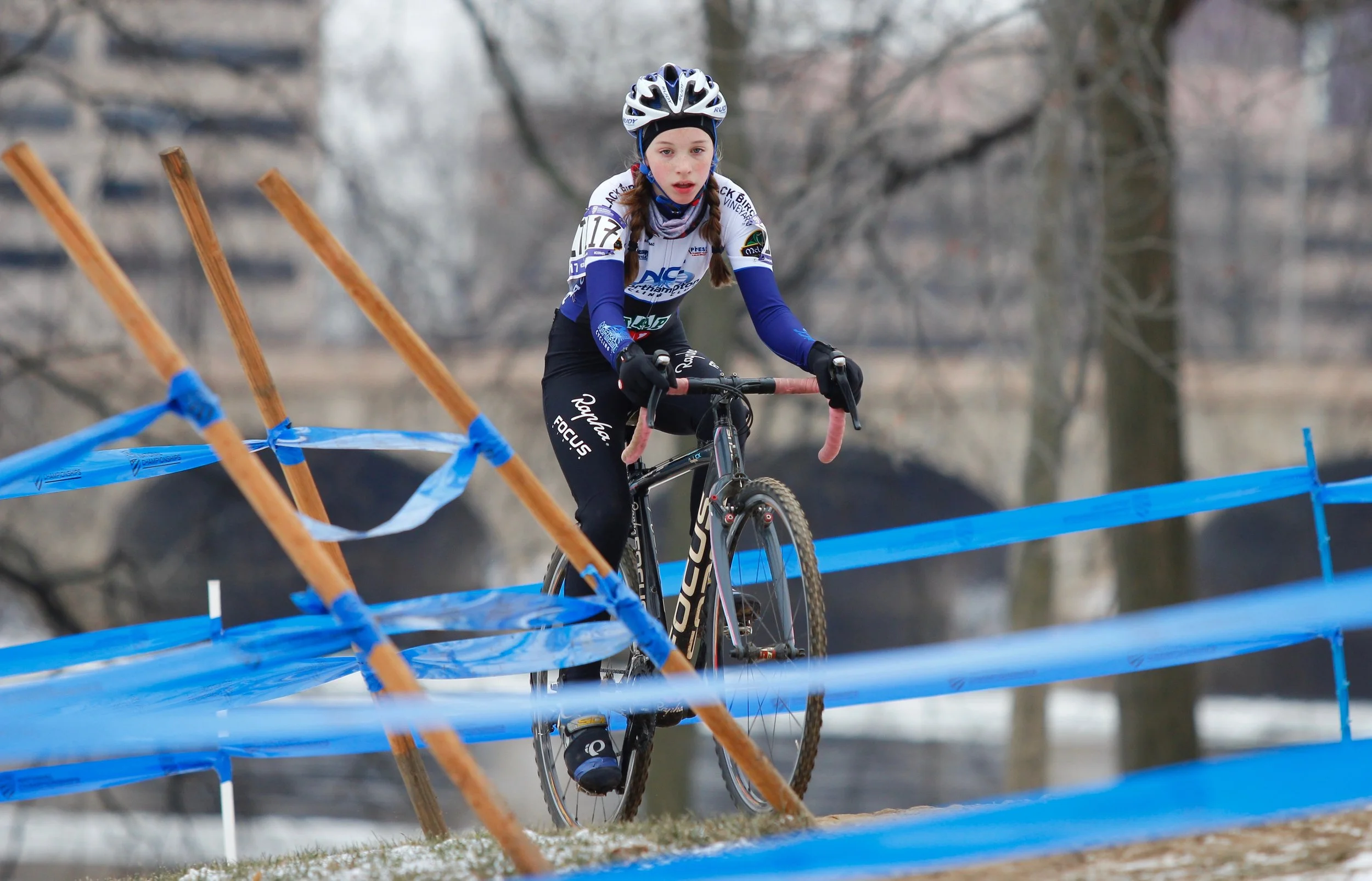 Mira Fowler rides the loops closest to the river during the Cyclocross National Championships in Hartford, Connecticut. Photo by Vicky Sama.