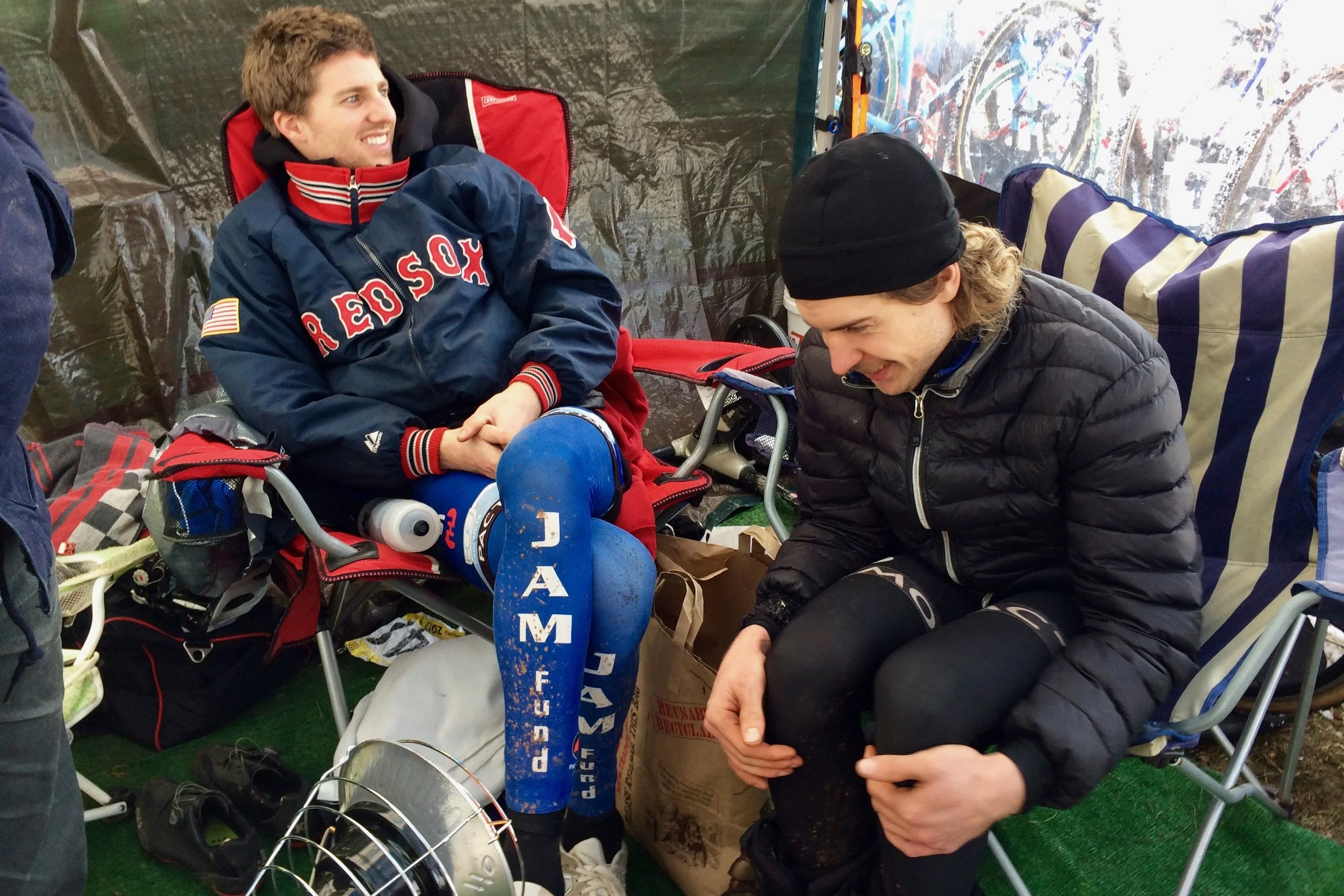 Kisseberth and Smith huddle near the space heater in the JAM Fund tent prior to the elite men's race at Cyclocross National Championships in Hartford, Connecticut on Jan. 8, 2017. Kisseberth finished 4th and Smith 13th. Photo by Vicky Sama.