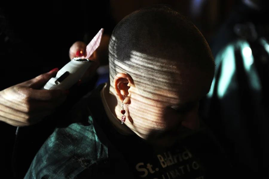 Reporter Megan Williams' head is shaved during a St. Baldrick's head shaving event on Thursday, March 27, 2014, at The Biltmore in Charlottesville. The head shave raises money for childhood cancer research. Williams was inspired by 8-year old Norah Mastrandea, who died in October from brain cancer. Williams raised $2,600 for the event.