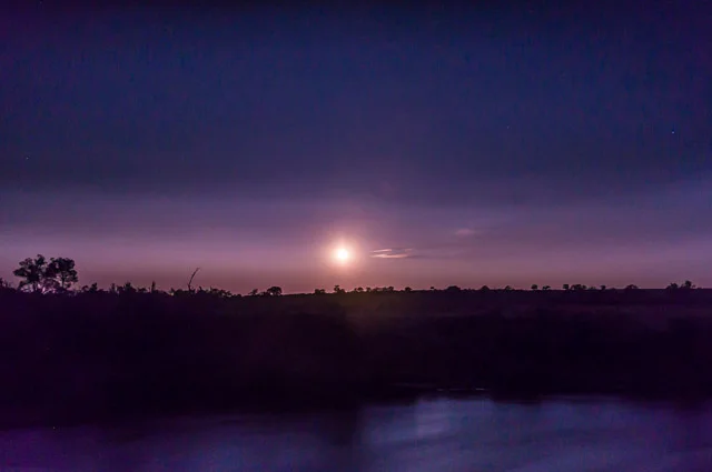 Watching the moon rise from our camsiite on the banks of the Mara River