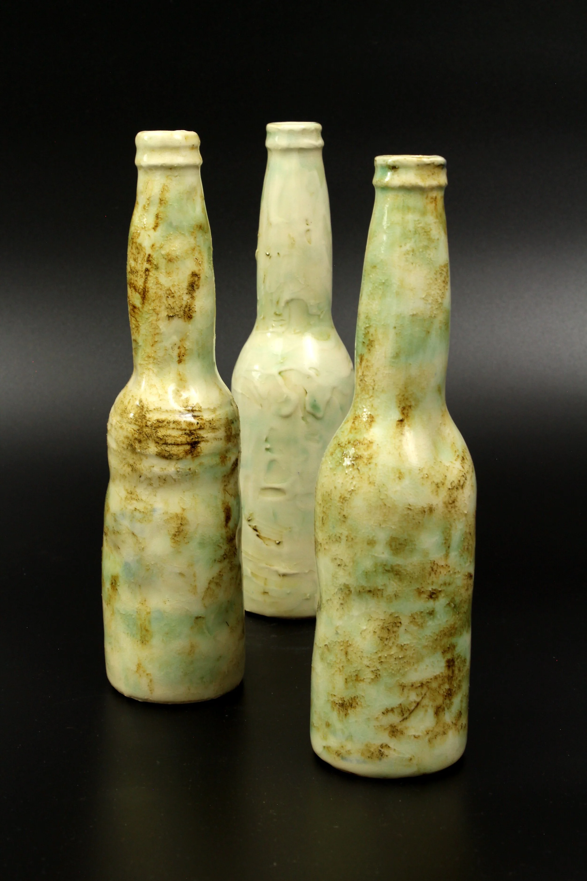 Zombie Bottles J.S. Herbert Stoneware, slip, and glaze 8.5 x 2 in. each Click image to enlarge ⦿ Inquire