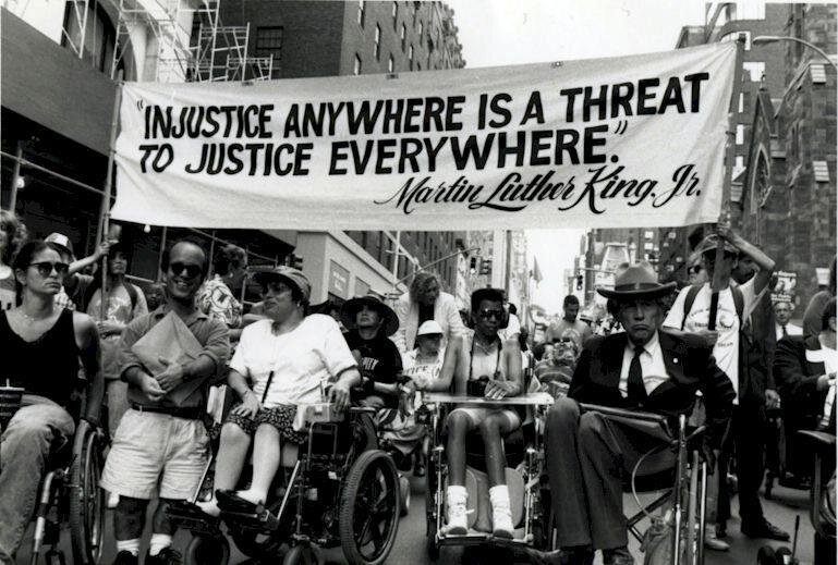 protestors in the street with banner