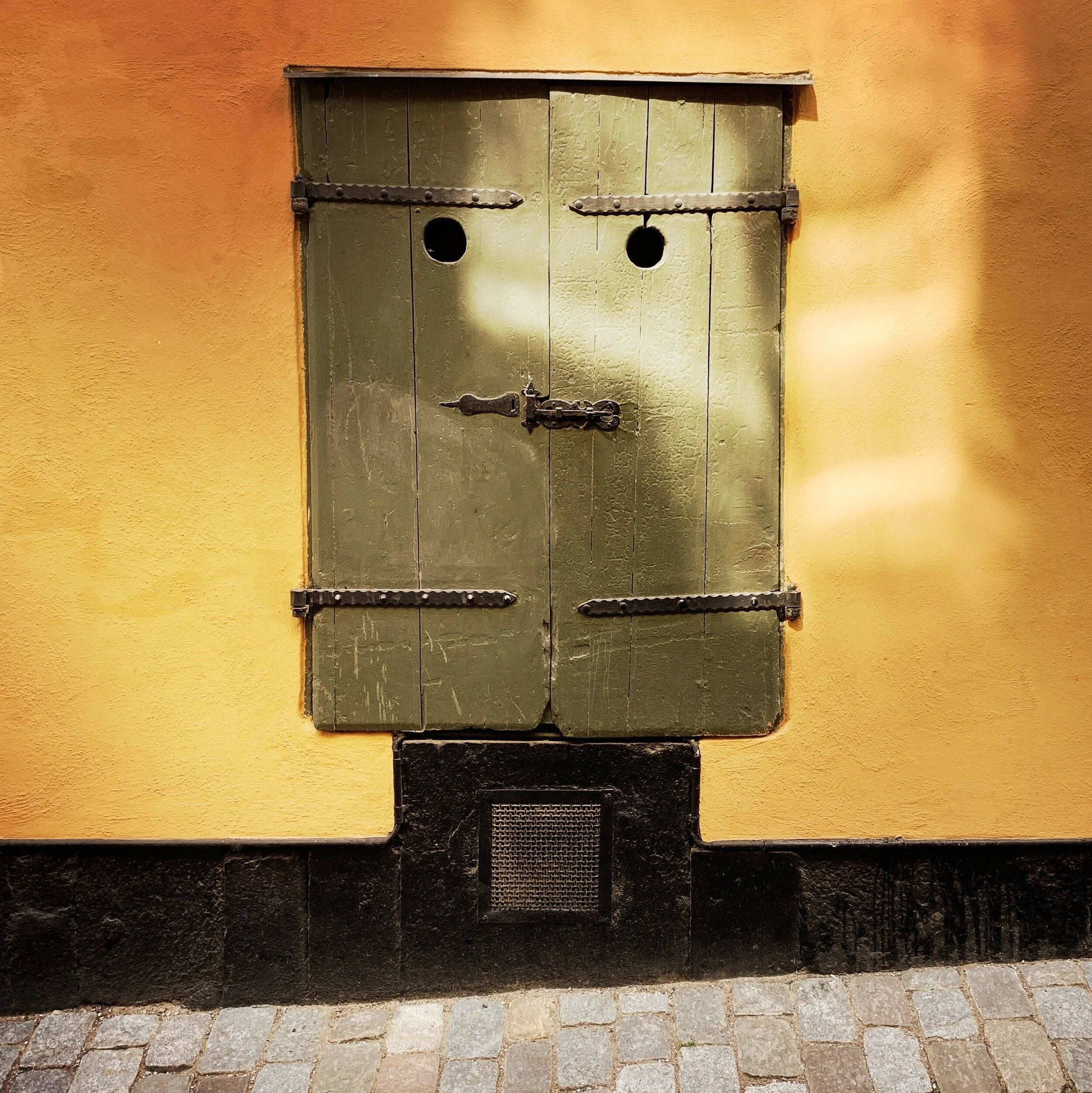 Susan Raines "Green Door Man, Stockholm" Archival Photograph Image Size - 11 x 11 Framed Size - 20 x 21 Click image to enlarge ⦿ Inquire