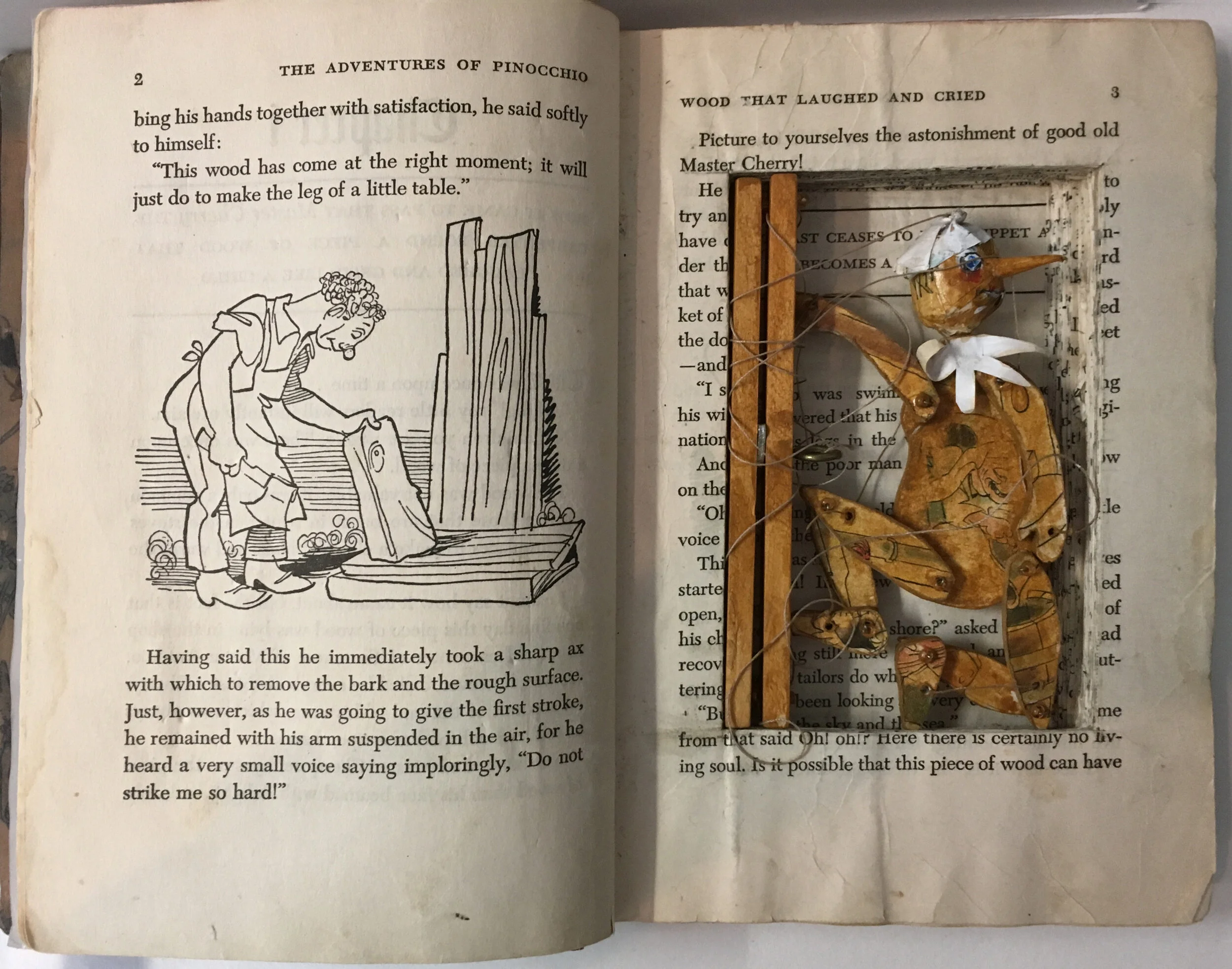 Pinocchio Carolee Jakes Altered book with reconstructed covers and puppet. Pinocchio puppet is made from book illustrations, acrylic paint, beads, thread, and wood. Click image to enlarge ⦿ Inquire