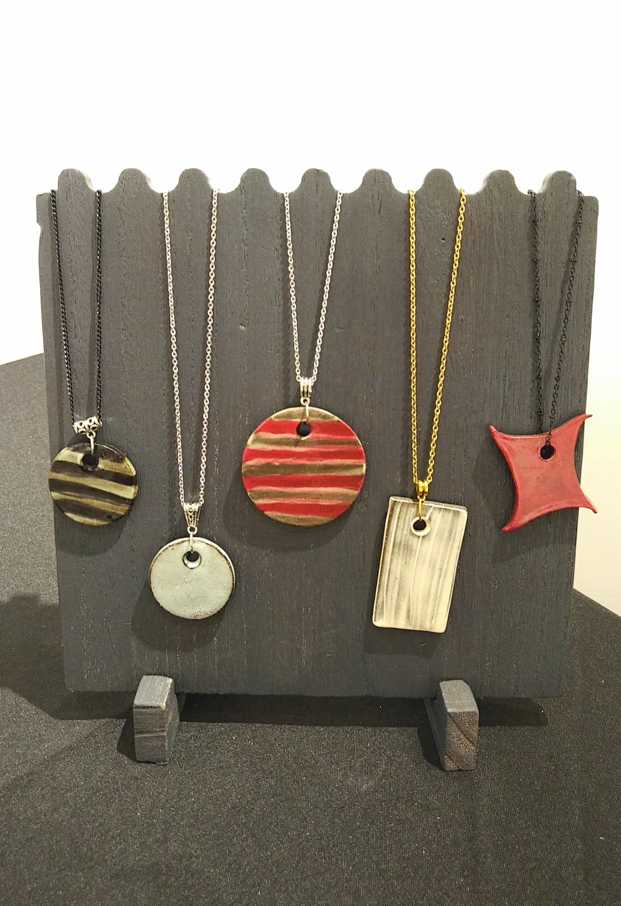 Assorted Ceramic Necklaces J.S. Herbert Stoneware, slip, glaze Assorted Dimensions  Various Prices; Please Inquire Click image to enlarge ⦿ Inquire