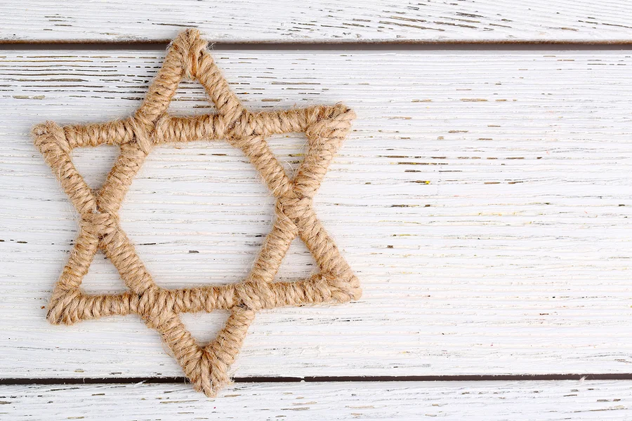 bigstock-Star-of-David-on-wooden-backgr-71044888.jpg