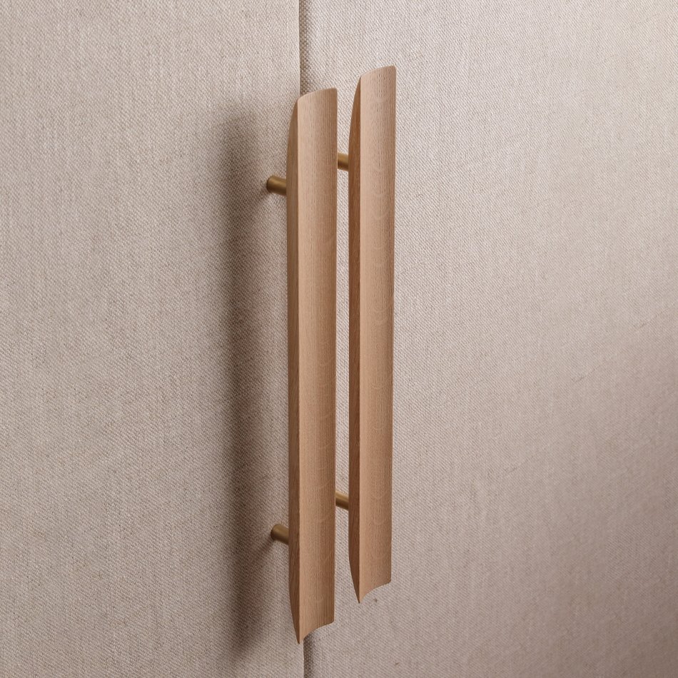 A wooden wall-mounted coat rack with two curved hooks on a beige textured wall.