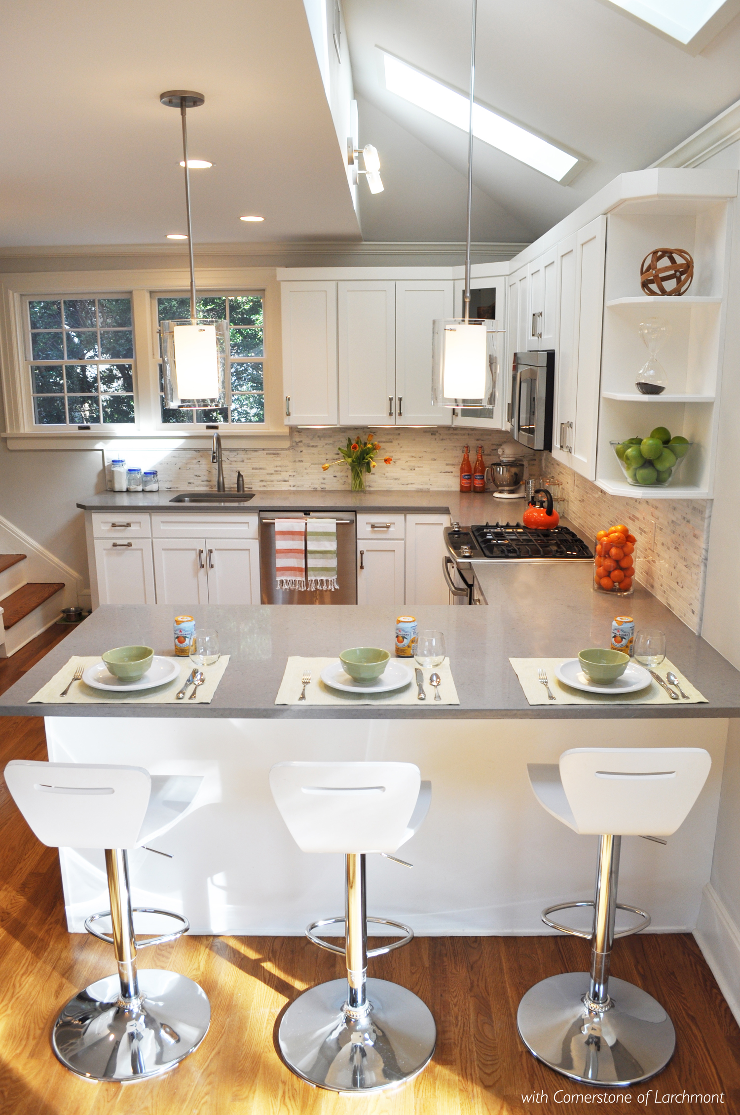 KAM DESIGN LLC_Kitchen Remodel_White Cabinets_Peninsula_Glass Pendants_Caesarstone.jpg