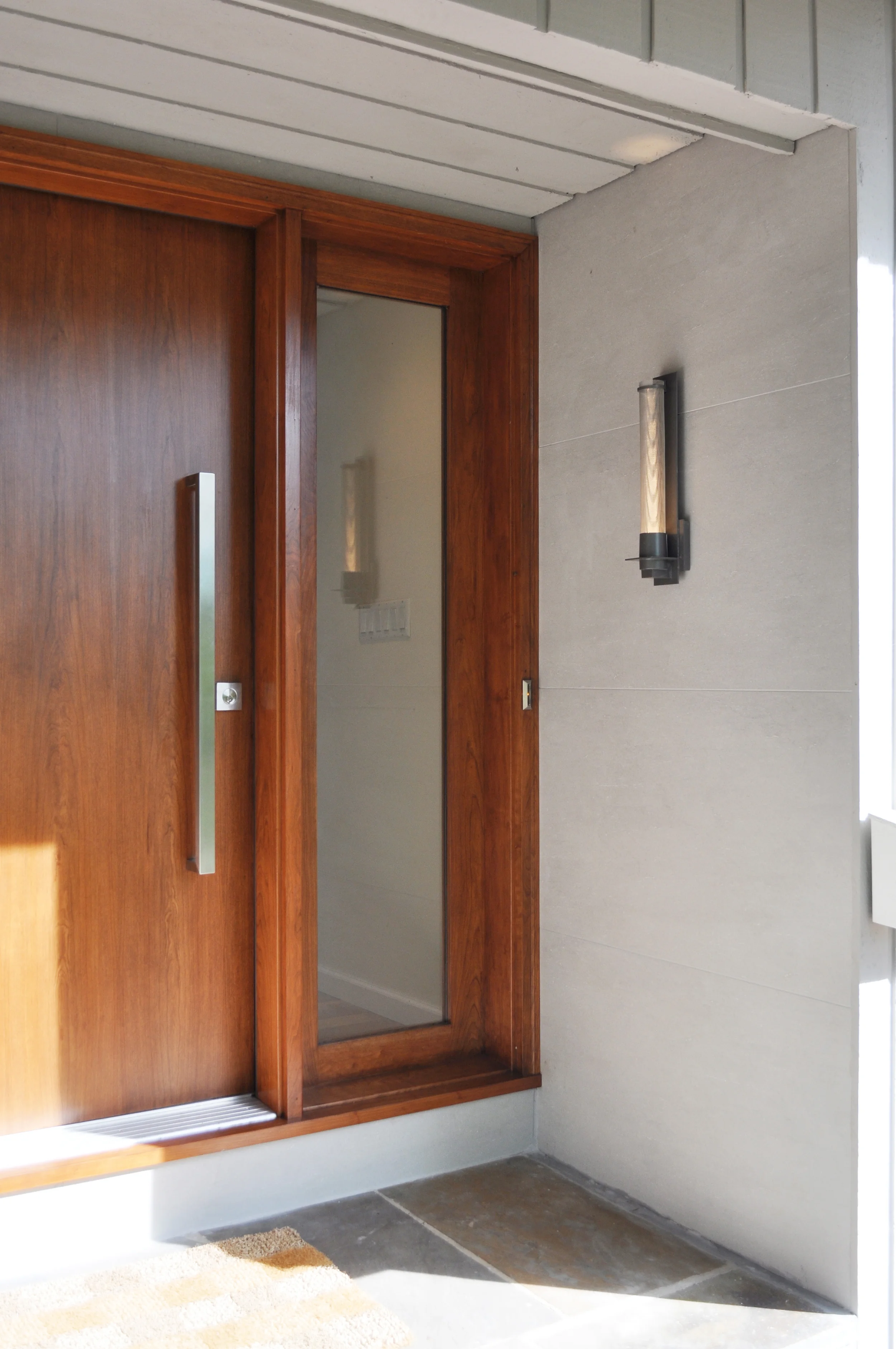 Front Door_Modern Cherry Slab Front Entry Door_Stainless Hardware_Hubbardton Forge Sconce_Porcelain Wall Tile_KAM DESIGN.jpg