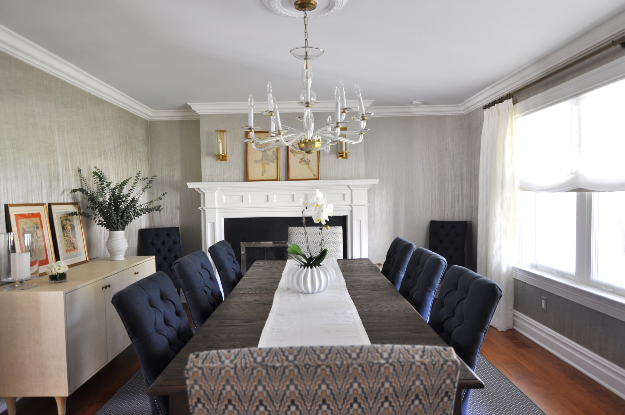   CLASSIC DINING ROOM , Mamaroneck, NY: When the homeowners moved into their new dream home, they brought with them their dining table, chairs and chandelier, but envisioned a more finished, inspired space. The host chairs were reupholstered in a gra