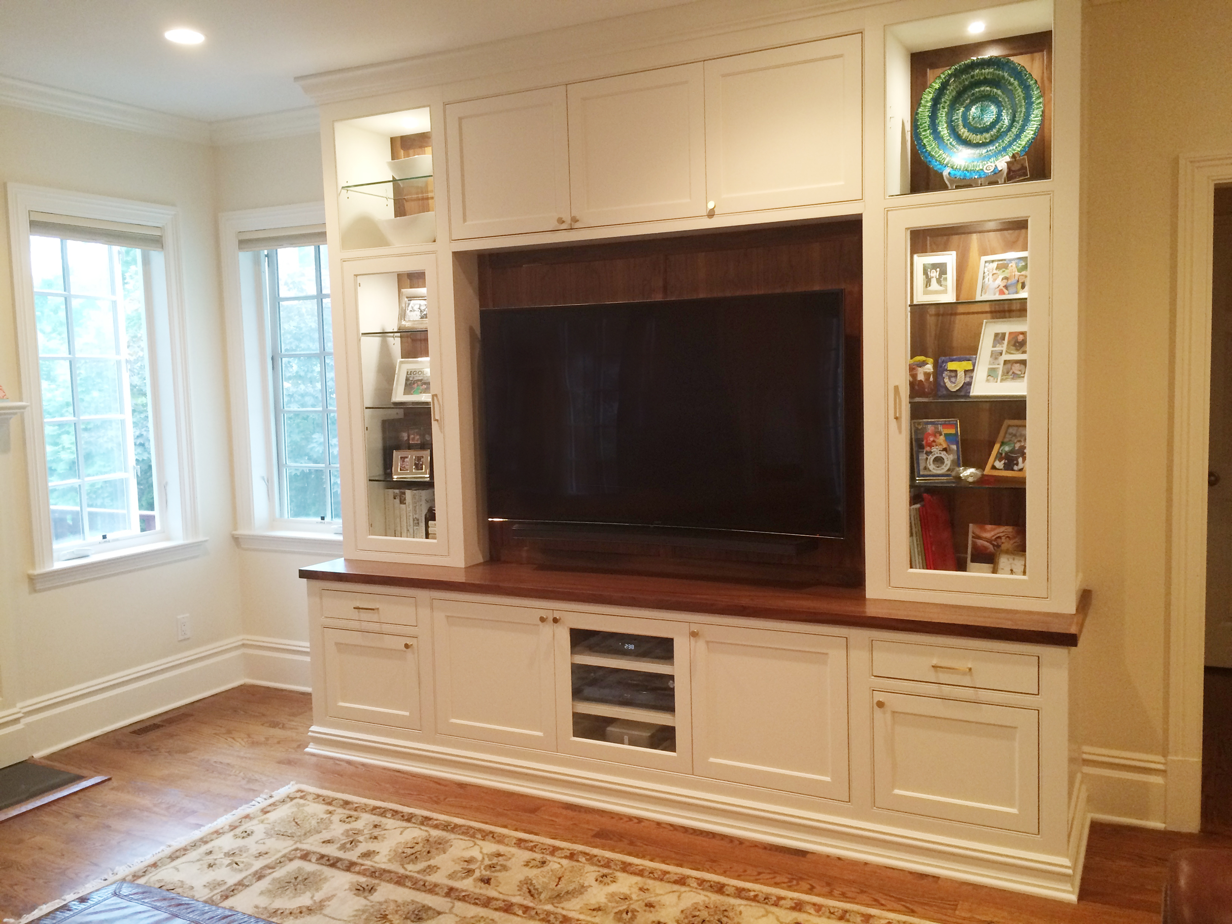 KAM DESIGN_Custom Millwork_White Painted_Walnut Top_Walnut Back Panels_Glass Cabinets_Pin Lights_Scarsdale NY Family Room_2016_webangle.jpg