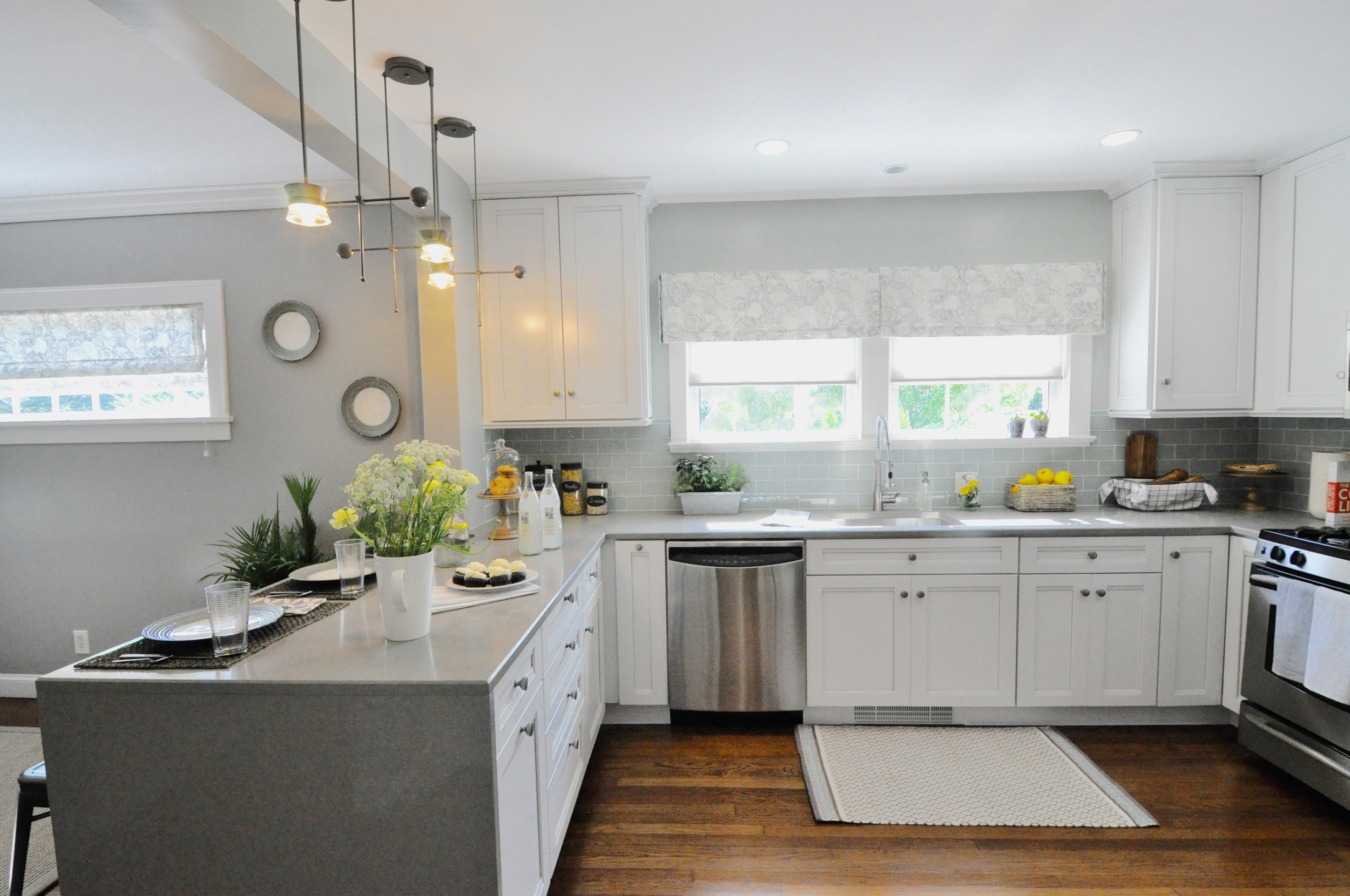 Kim Mitchell Design Lead_HGTV_Buying and Selling with The Property Brothers_Season 5_Episode 8_Kitchen Remodel_Sink_Peninsula_Modern Industrial Kitchen_Grey Kitchen_8_31_2016 airdate.jpg