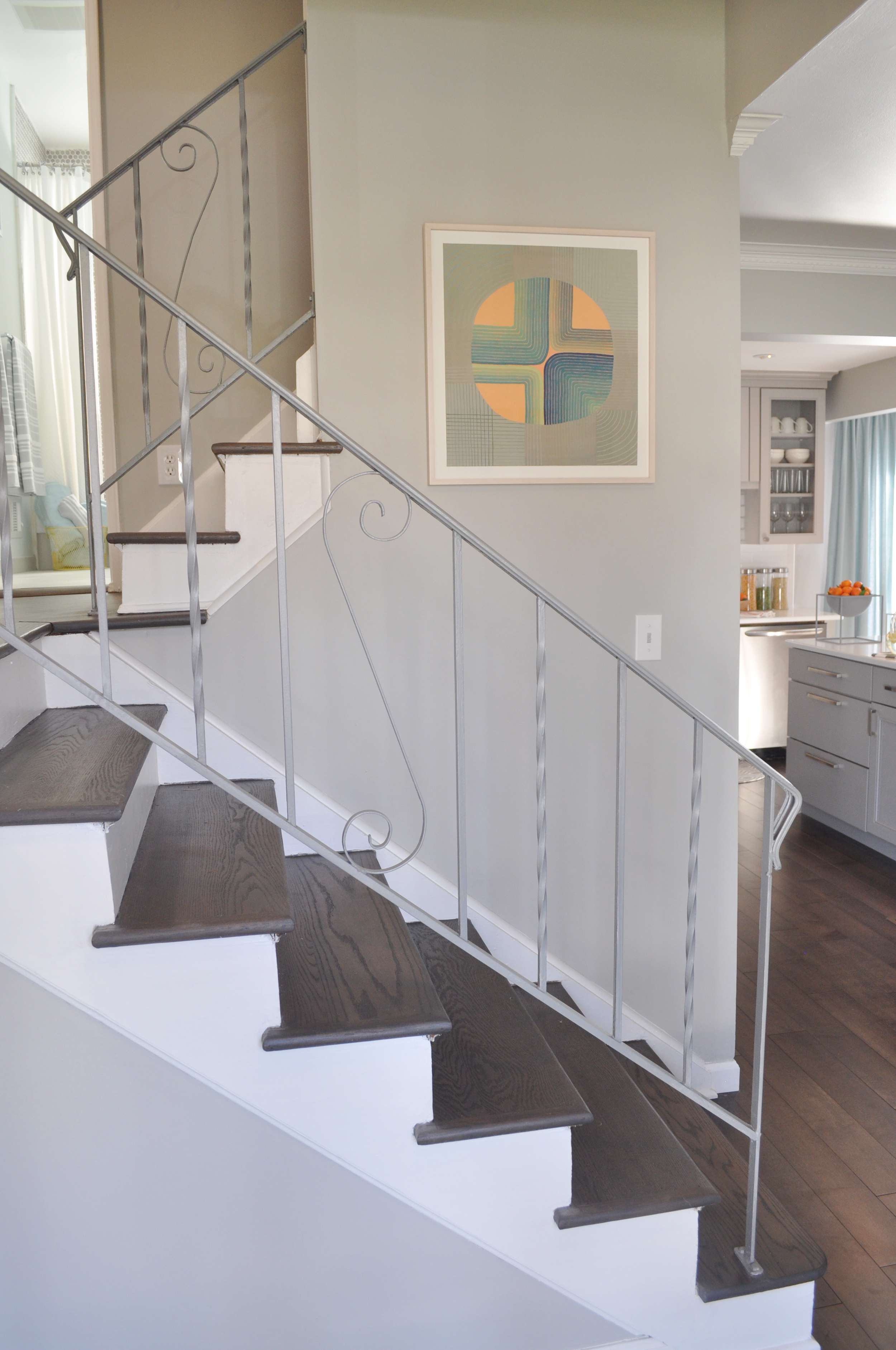 Kim Annick Mitchell Production Designer_HGTV_Buying and Seling with The Property Brothers_Season 3_Episode 316_Gray Entry Staircase_Modern Art.jpg