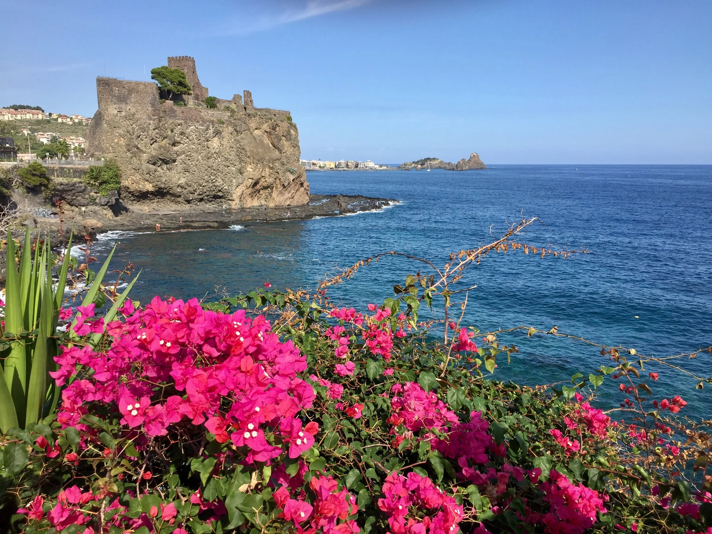 In the scenic seaside town of Acitrezza just outside Catania, you can enjoy a peaceful stroll overlooking the beautiful Aci Castello