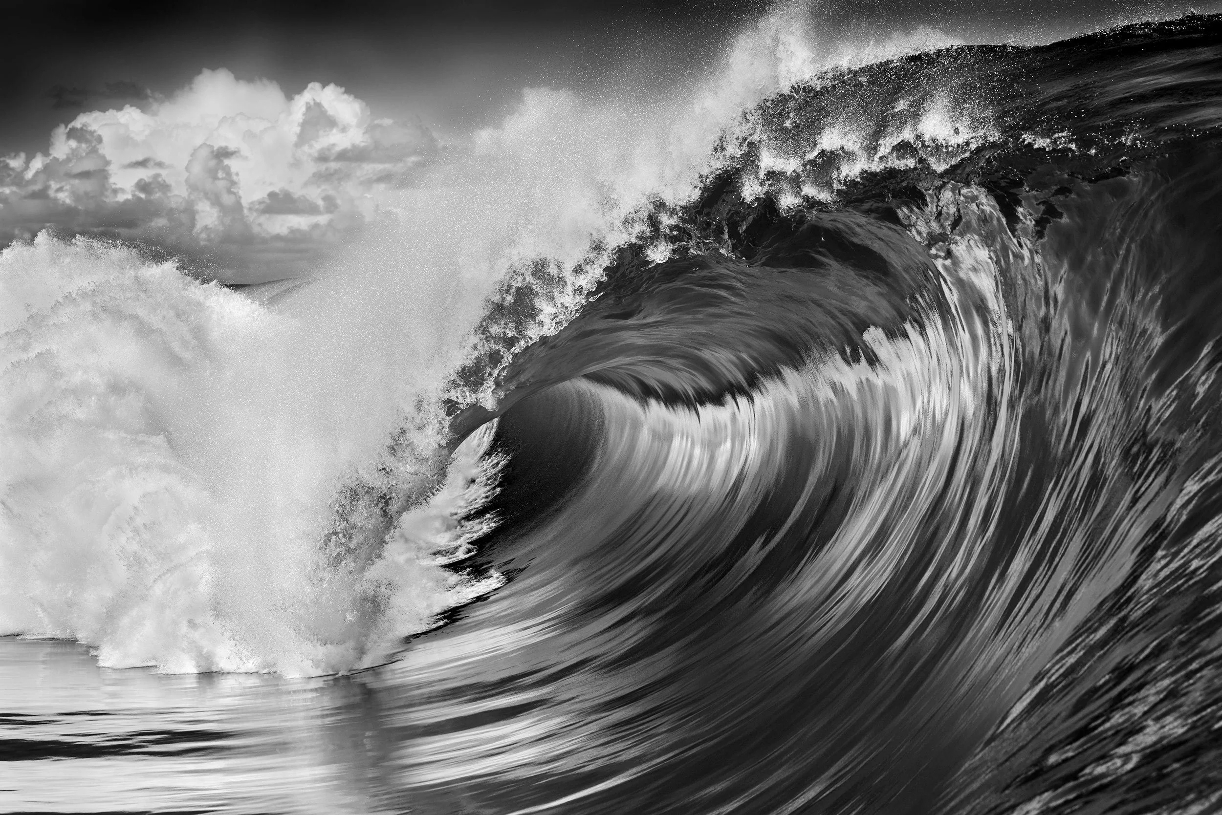 A stunning black and white masterpiece image, a wave so smooth, reflects like a mirror, photographed by Ted Grambeau.