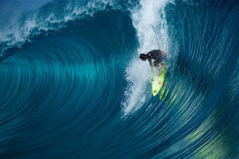 ^ MICHEL BOUREZ Bourez about to get smashed at Teahupoo on one of the worst wipe-outs he's ever had. THE SPARTAN, a surfer who knows no fear, a powerful gladiator, relentless charger. Bourez is from a small band of lunatics who will go when others won't dare. He took the latest of late drops on a perfect Teahupoo beast and nearly pulled it off. That evening Michel underwent reconstructive surgery on his broken and mangled hand, into which the surgeon inserted various metal parts – Commit or be committed .