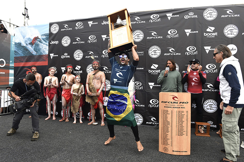 Italo ringing the Bell as Rip Curl co founder Doug (Claw) Warbrick watches on
