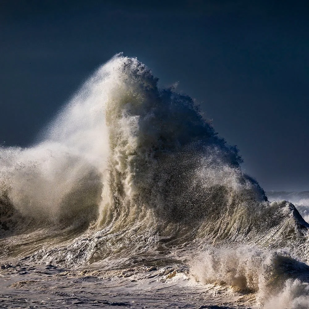 Ocean Sculpture

An uprising in the Atlantic, majestic, immense.
Where colliding energies carve liquid monuments,
and the sea, in a surge of power,
reaches skyward as if to touch the heavens.