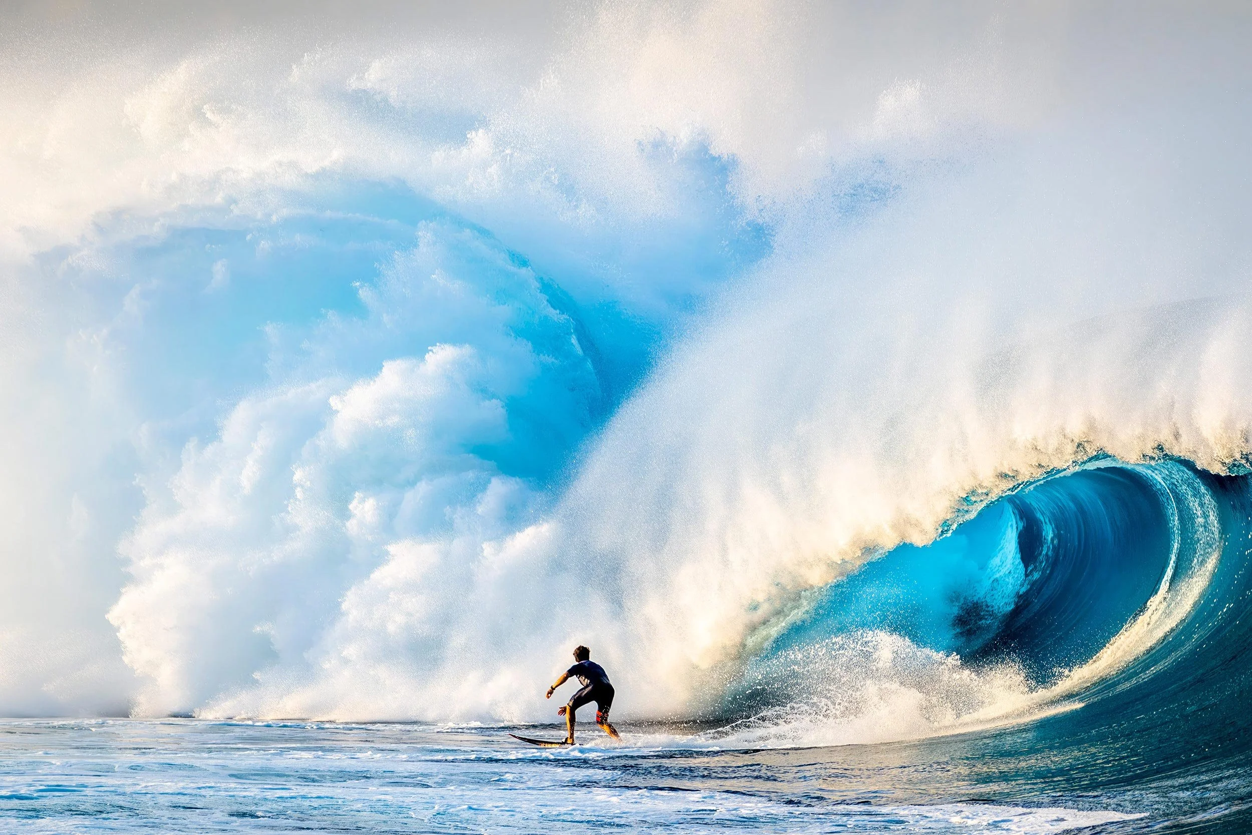 Kai Lenny about to enter the Thunder Dome, a magnificent wave at Teahupoo, photographed by Ted Grambeau.