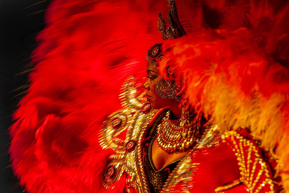 Red Lady in elaborate feather dance costume at 'Carnaval' Rio de Janeiro, Brazil.