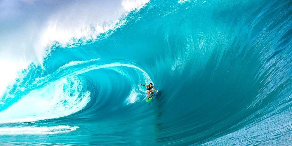 Matahi Drollet on a high-speed line at Teahupo’o (tow-in, Aug 2025), wide-format surf print by Ted Grambeau.