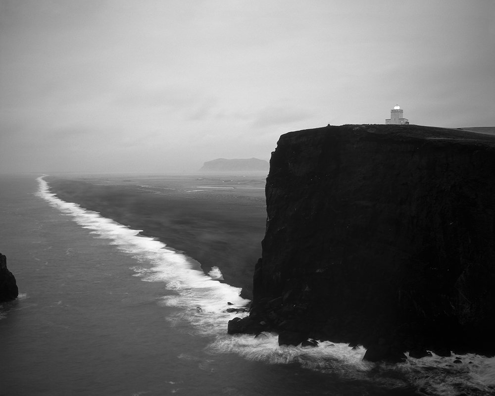 Landmark Lighthouse at Door Hill Island, Dyrhólaey Promontory, Iceland.