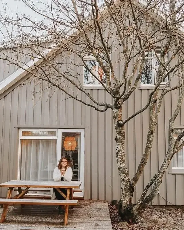 Sonia Nicolson, architect and former senior lecturer, photographed outside a timber house in Iceland