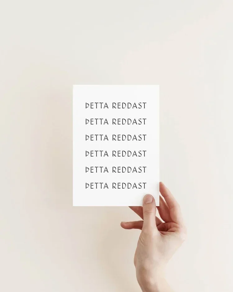 Icelandic typography art print featuring the phrase “þetta reddast”, meaning it will all work out, minimalist Nordic design.