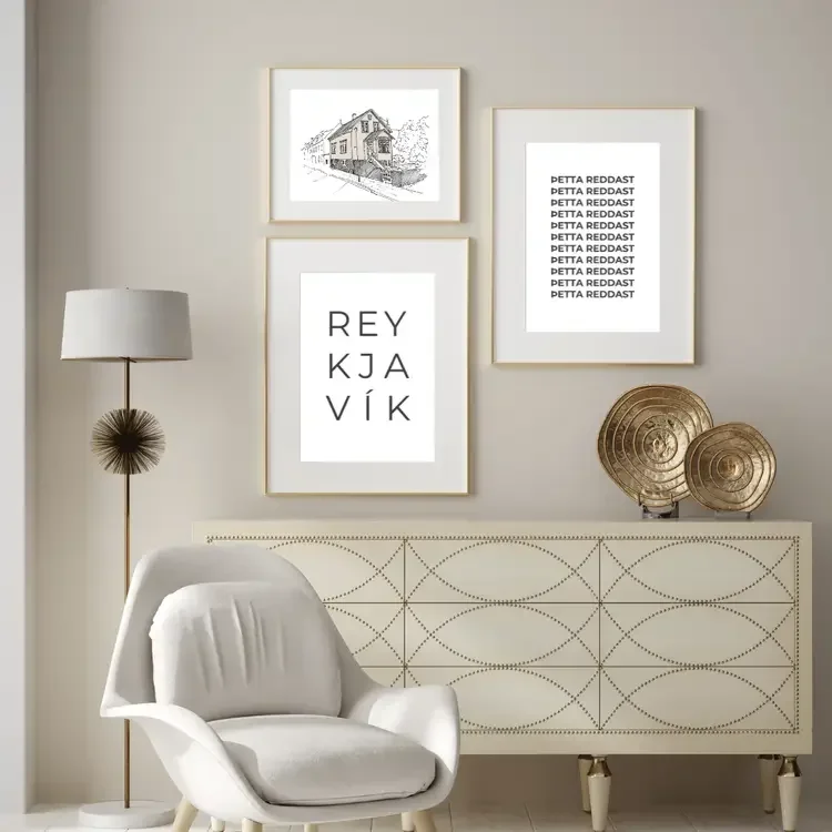 Scandinavian gallery wall with Icelandic art prints including Reykjavík typography, “þetta reddast” quote and hand drawn architectural sketch in a minimalist Nordic interior.