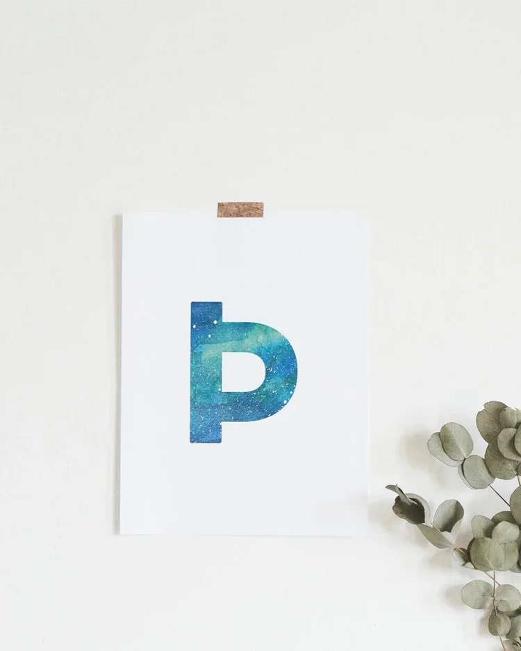 Graphic postcard featuring the Icelandic letter þ filled with a Northern Lights watercolour. A unique Reykjavik souvenir and art print by Sonia Nicolson.