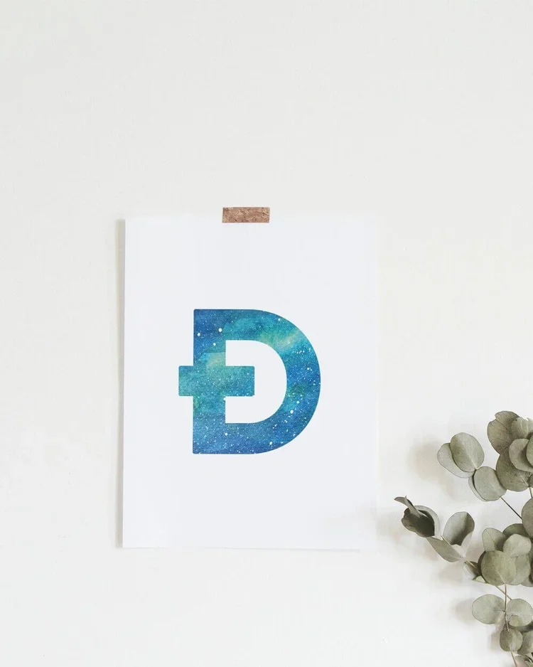 Graphic postcard featuring the Icelandic letter Ð filled with a Northern Lights watercolour. A unique Reykjavik souvenir and art print by Sonia Nicolson.