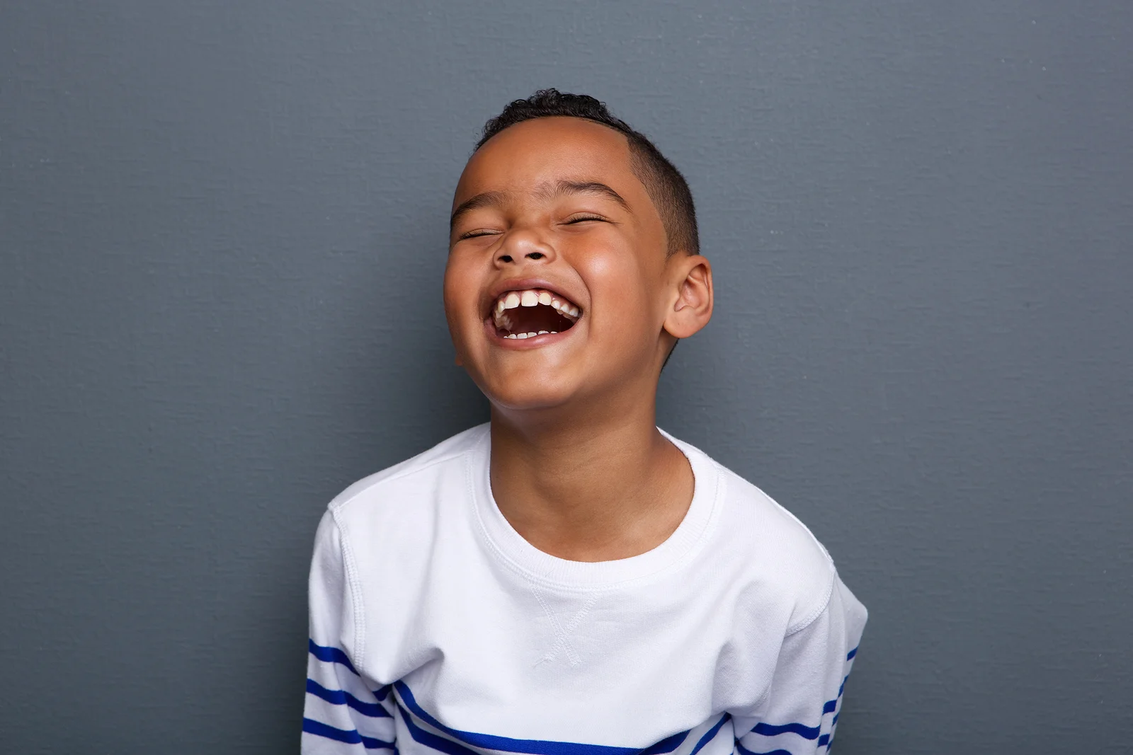 bigstock-Excited-Little-Boy-Laughing-65539366.jpg
