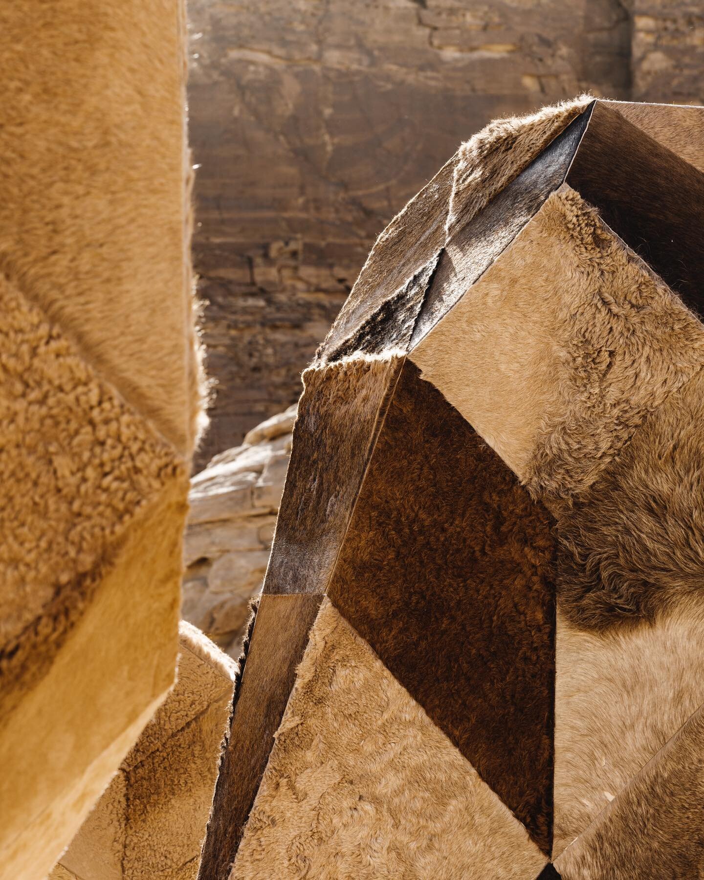 &ldquo;Camoulflage 2.0&rdquo; commissions by @rcu_sa for @_desertx AlUla 2022. Is a sculpture uses discarded camel skins on
an abstract, geometric base, resembling a rock formation in the desert;
like a camouflage, these camel hide sculptures merge i