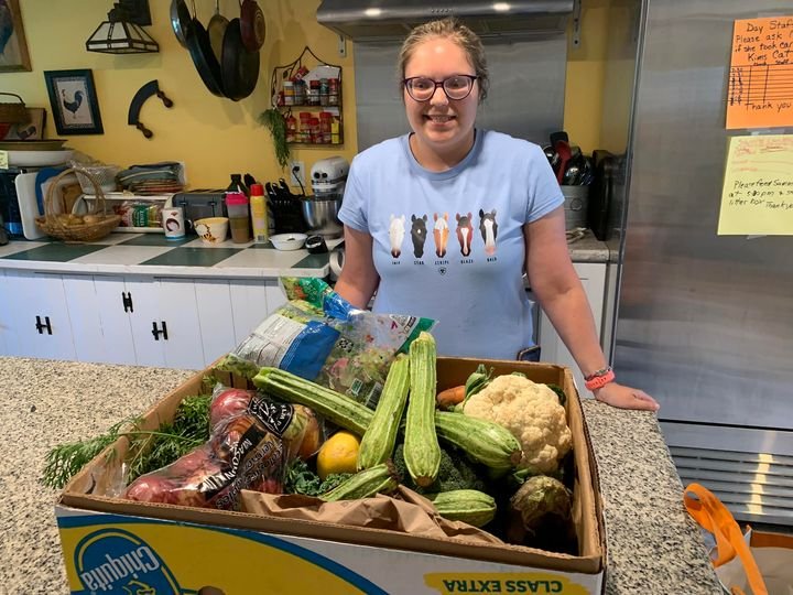 niki with vegetables from willing hands.jpg