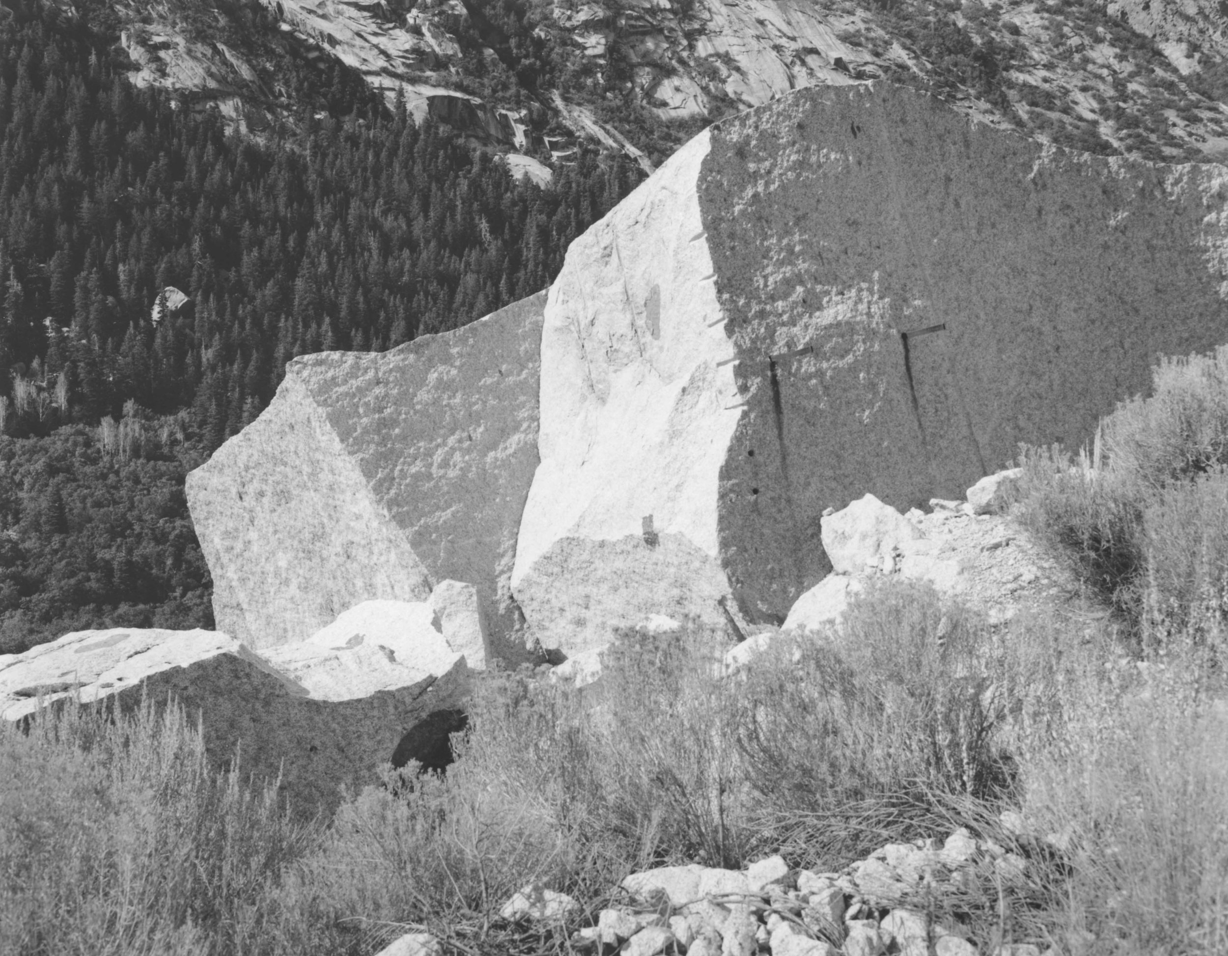   Jagged edges lined with drill holes and scaffold supports reveal the efforts of past Temple quarrymen at the Upper LDS Temple Granite Quarry in Little Cottonwood Canyon.  