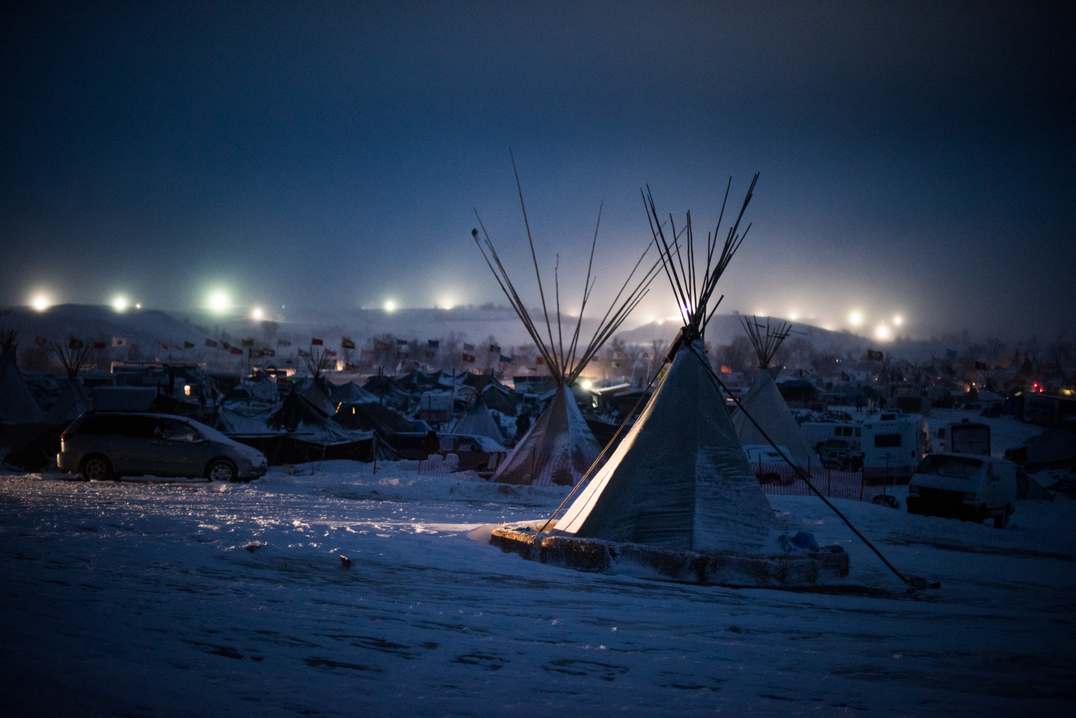  Blizzard conditions help the DAPL security lights illuminate the Oceti Sakowin camp at the Standing Rock Sioux Nation. December 4, 2016 