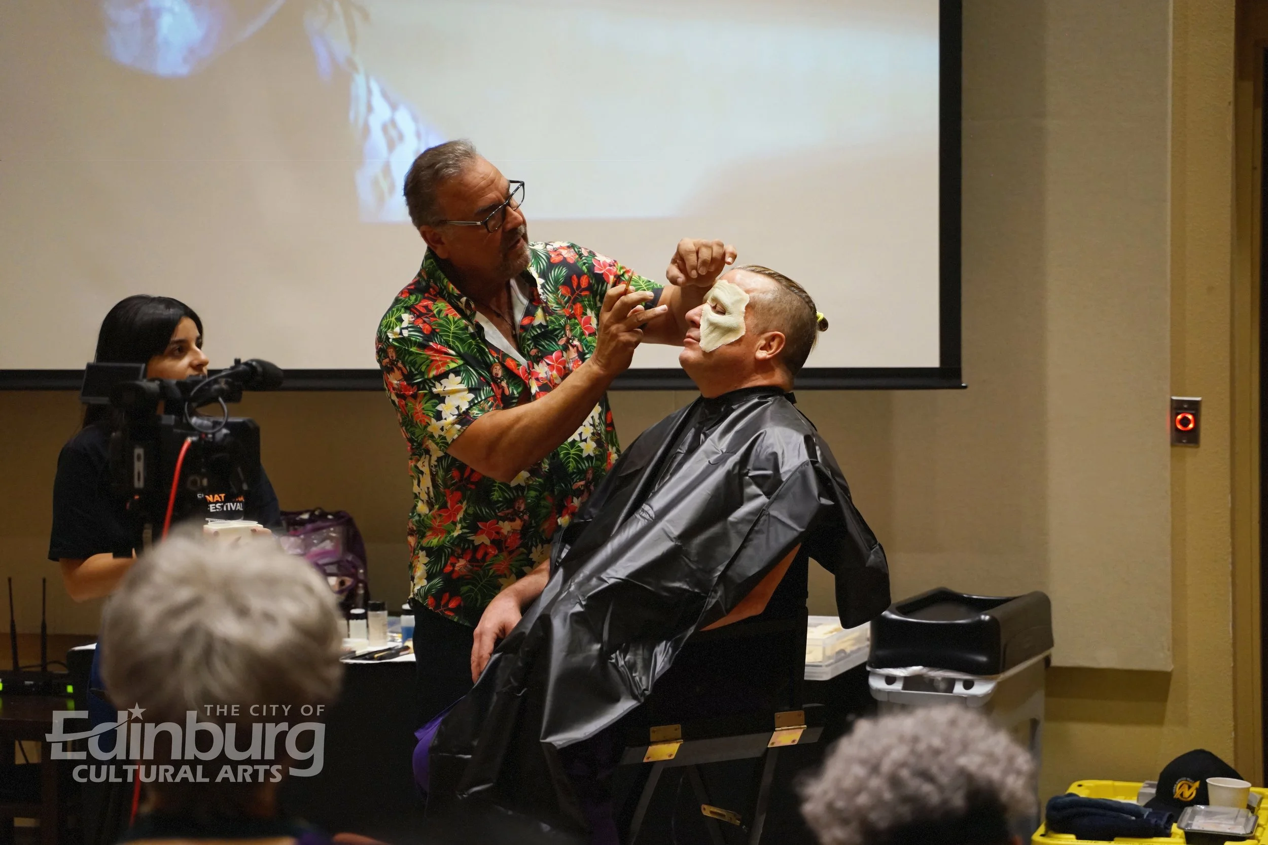 Makeup artist John Caglione applies Special Effects Makeup on Trey Mikolasky