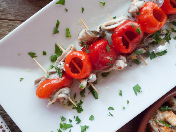 Boquerones, Spanish anchovies marinated in vinegar oil, skewered on toothpicks with piquillo peppers. An amazing no-cook tapa!