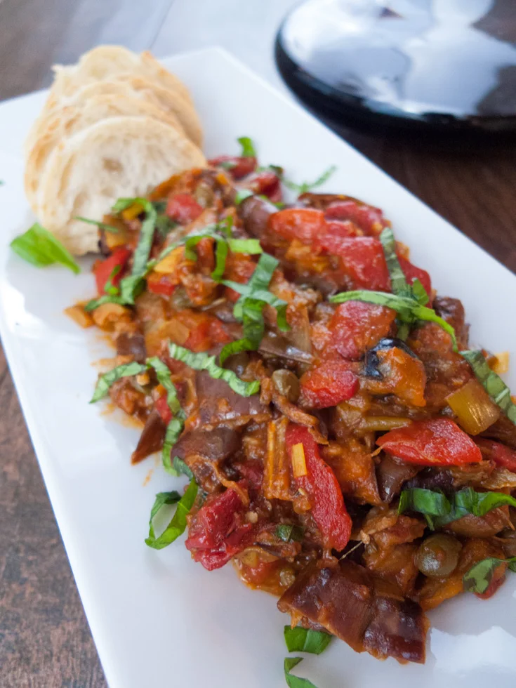 Low FODMAP Eggplant Caponata is easy and healthier than traditional versions. It's a great make-ahead appetizer recipe that also can be morphed into an awesome pasta sauce.