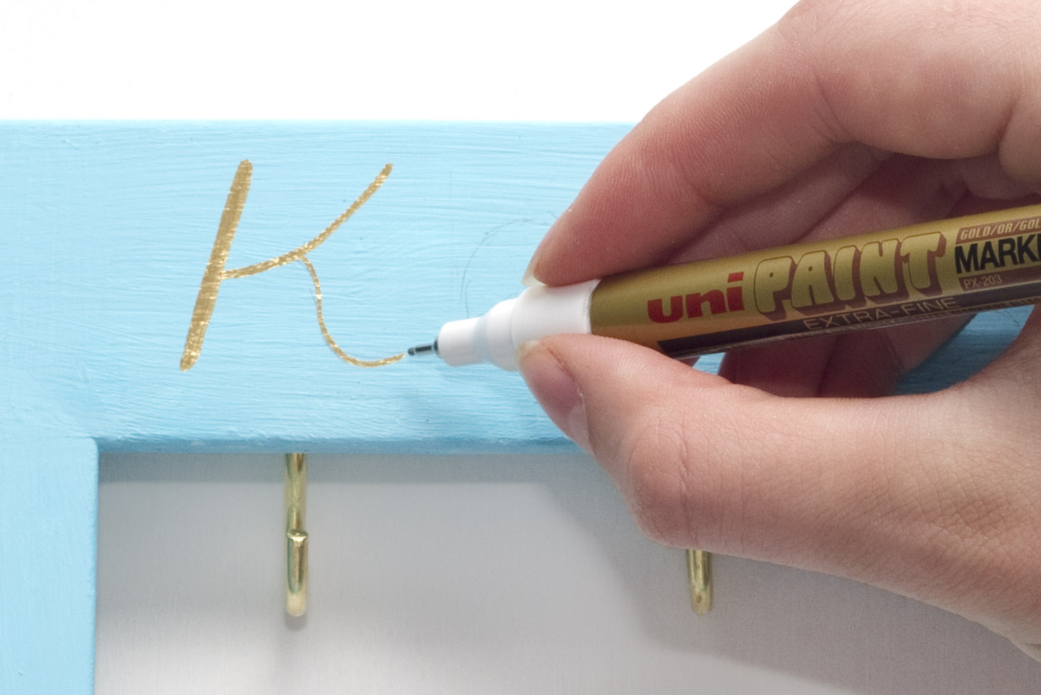 Step 3. Using a pencil, lightly write the word 'keys' on the upper part of the frame, and 'please' on the lower part. Once your happy with the writing, go over it with metallic gold marker - this looks great when it catches the light! Subscribe to my newsletter to receive fun craft ideas weekly!