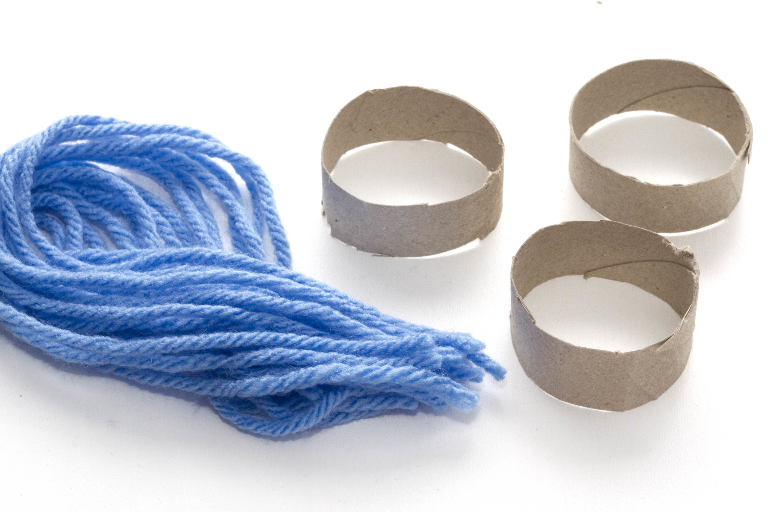 Step 1 Slice the toilet roll into sections (one toilet roll should make 4-5 hats). Then, cut the wool into 30cm pieces. Each hat will need quite a lot of these!