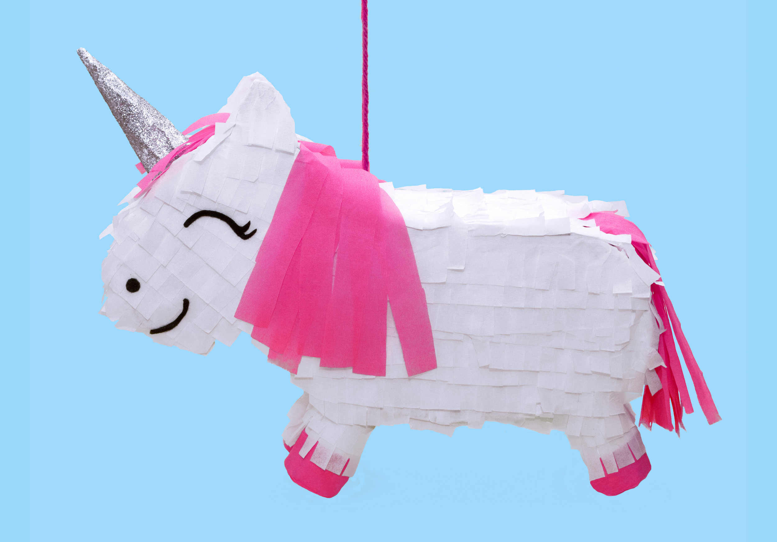 Step 5: Attach the crepe paper strips to the unicorn using double sided tape - make sure the whole unicorn is covered. Cut some strips of pink crepe paper stick on to create a mane and tail (tip: stick the tail on top of the flap you cut earlier, so when you lift the tail the flap opens up.) Cut the eyes, nose and mouth out of black felt and stick onto the face. Then cover the horn in glue and sprinkle on the glitter. Now just add some sweets and you have the perfect party game! Subscribe to my newsletter to receive fun craft ideas weekly! Please note: this blog post contains affiliate links, however all opinions are my own and I only link to products that I personally recommend.