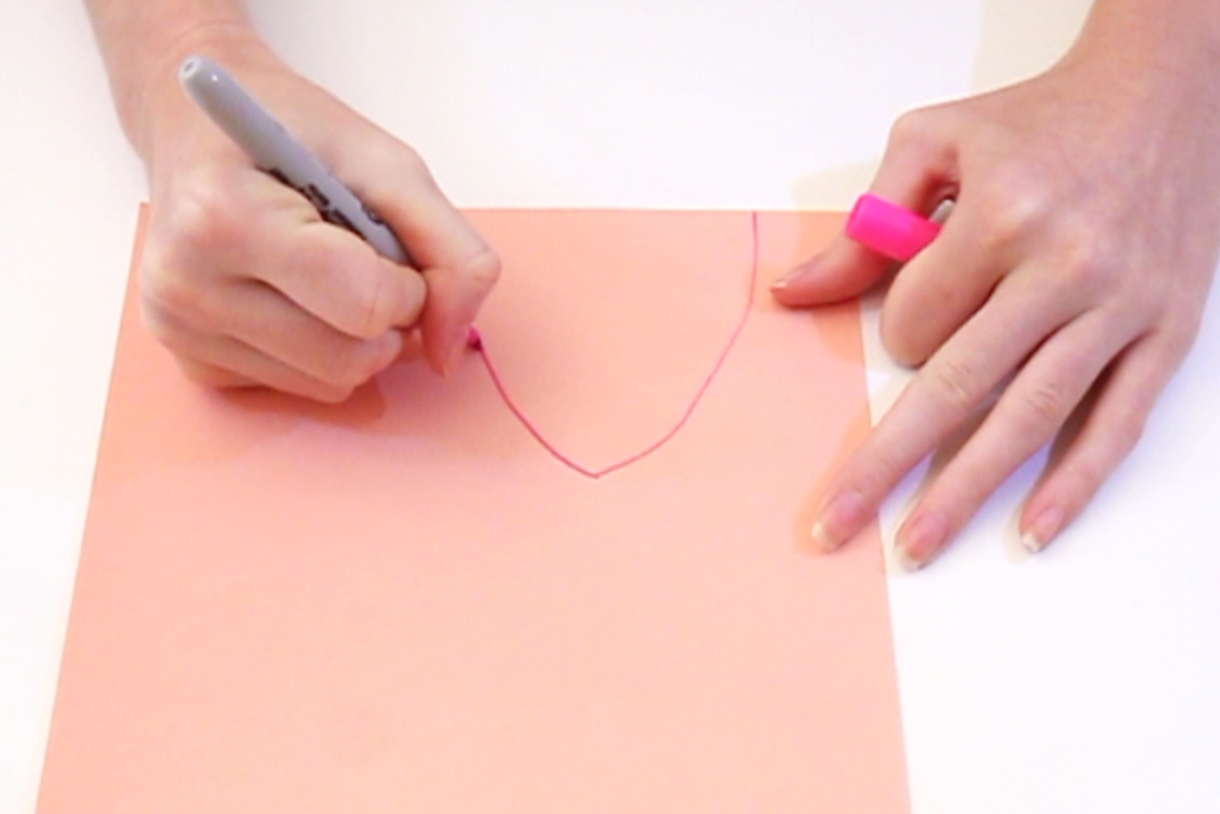 Step 1 Using the pen, draw the shape you want your fairy door to be on a pink piece of card. This should be approximately 12 cm tall.
