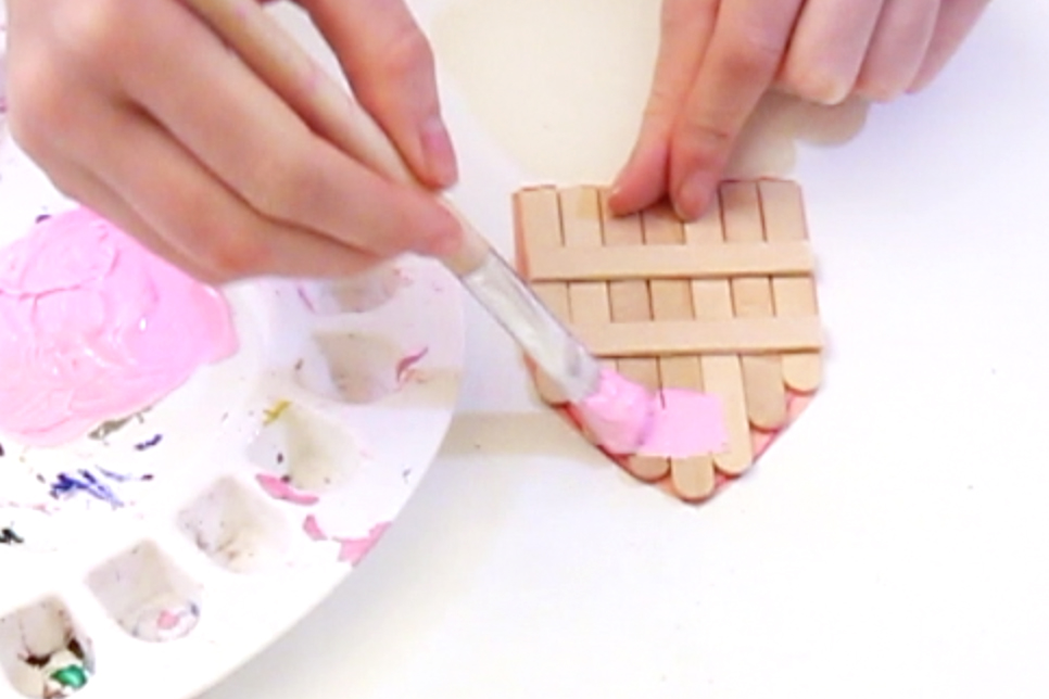 Step 4 Once you have cut out the fairy door, mix up the paint to the colour you like, and paint the lolly sticks. Leave to dry.