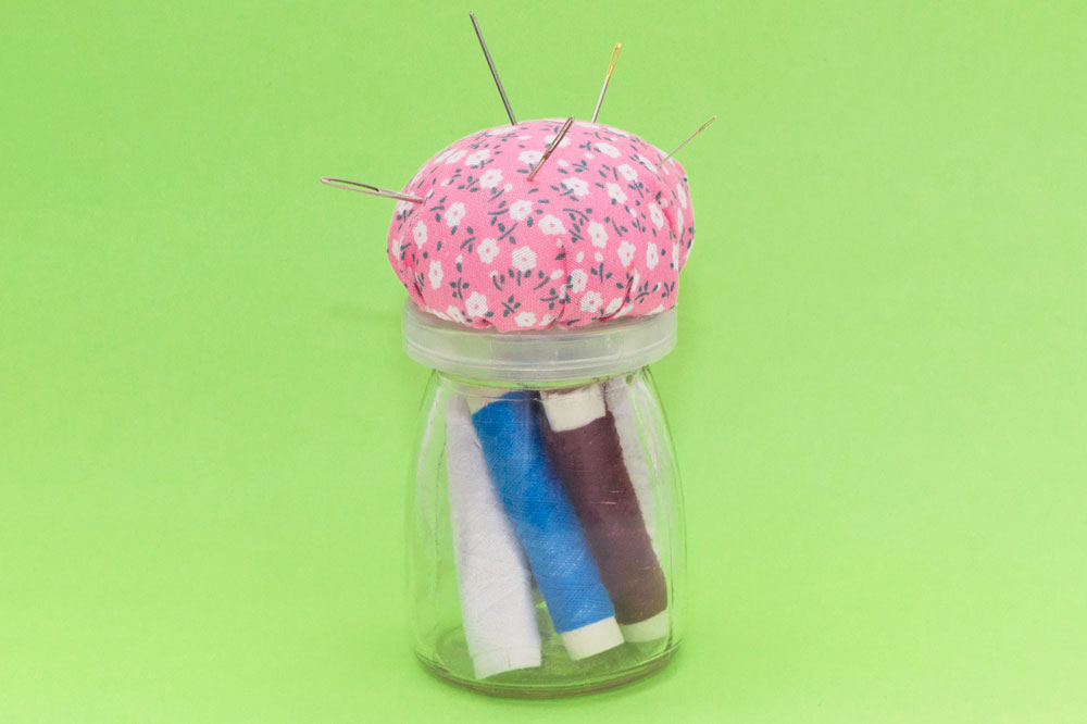 Step 3 Use the glue gun to put quite a bit of glue on the lid of the jar, then stick the pin cushion to the lid. Once the glue is dry the pin cushion jar is ready to use! Subscribe to my newsletter to receive fun craft ideas and freebies! Please note: this blog post contains affiliate links, however all opinions are my own and I only link to products that I personally use and recommend.