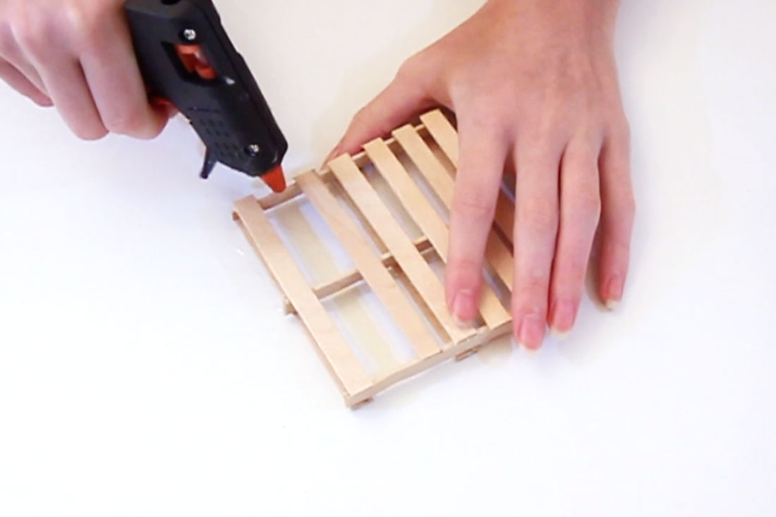 Step 3 Glue down the remaining 7 lolly sticks flat on top of the three on their edges. Ensure they are evenly spaced. Subscribe to my newsletter to receive fun craft ideas weekly! Please note: this blog post contains affiliate links, however all opinions are my own and I only link to products that I personally use and recommend. Here's a video showing you how to make this DIY pallet coaster. Subscribe to my youtube channel for more crafty videos!