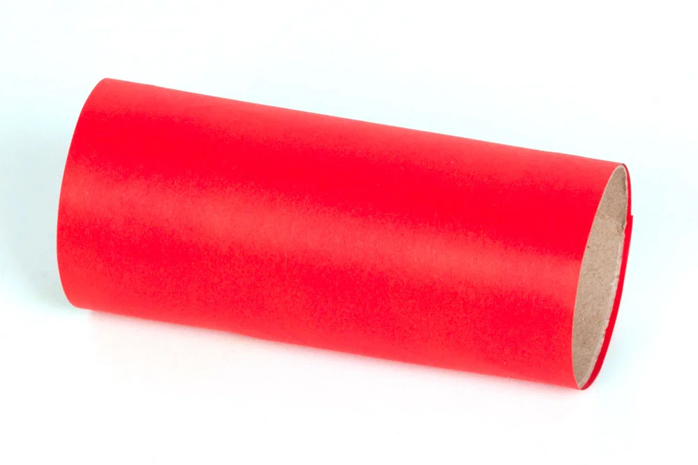 Step 1: Cut a strip of red paper that is the same height as the toilet roll tube. cover the paper in glue and wrap around the tube. This will form the body of the space rocket.