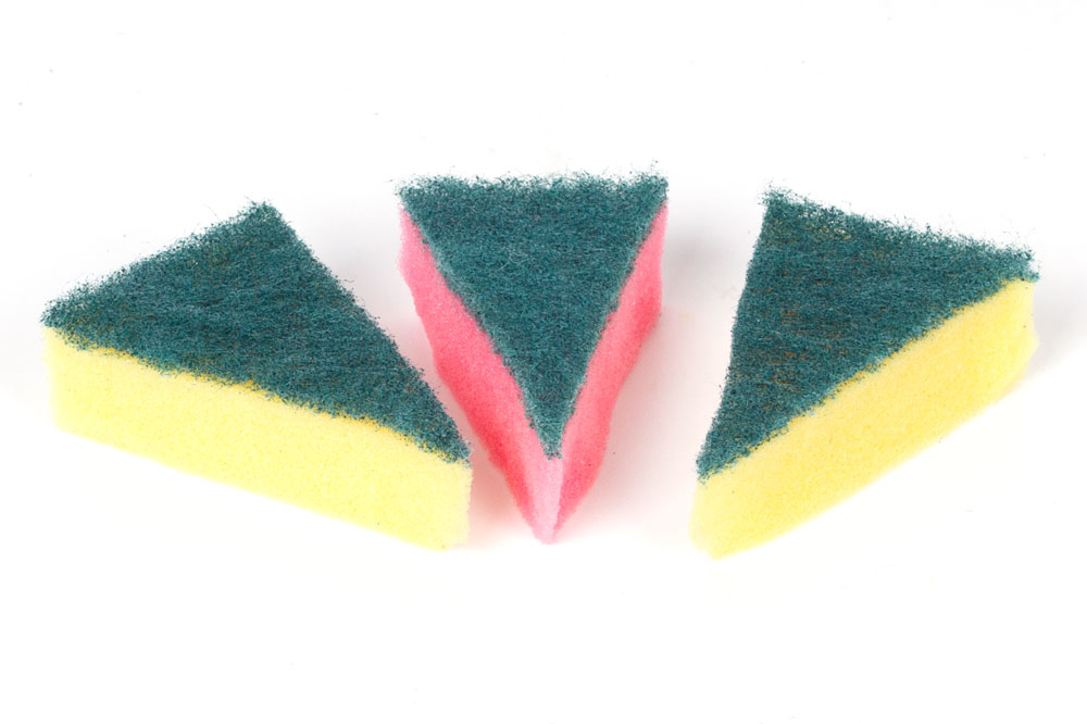 Step 1 Cut the sponges into triangles to create the cake slice shape. Start cutting from the corner towards the centre of the opposite edge of the sponge. Try to make all three sponges as similar in shape and size as possible.