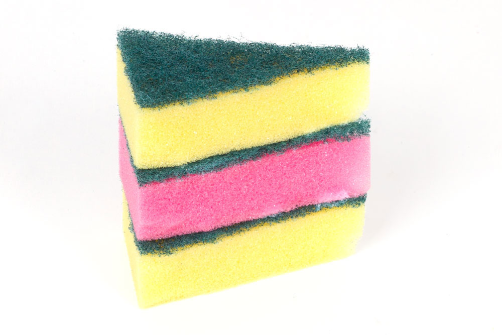 Step 2 Using the PVA glue, stick the three sponges together. I layered mine so that there is a pink sponge in between two yellow sponges - so it looks like a vanilla and strawberry cake! Wait for the glue to dry.